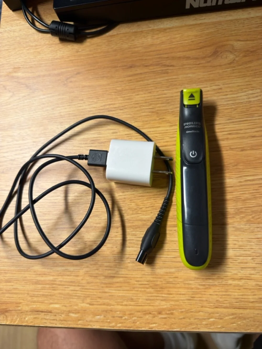 Philips green and black electric nose trimmer with charger